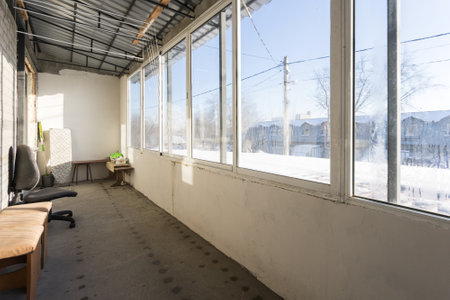 the balcony of an apartment on the upper floors of an apartment buildingの写真素材