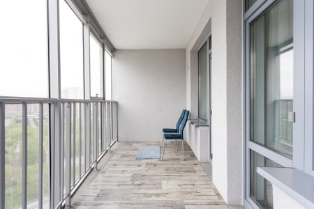 the balcony of an apartment on the upper floors of an apartment buildingの写真素材
