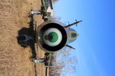 Military fighter aircraft in the field, closeup of photo with soft focusの写真素材