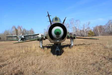 Old military airplane in the fieldの写真素材