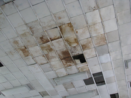 Dirty white tiles in a modern building, closeup of photoの写真素材