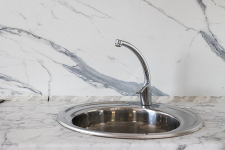 kitchen faucet on a stylish metal sink