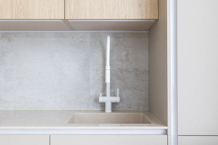 kitchen faucet on a stylish metal sinkの写真素材