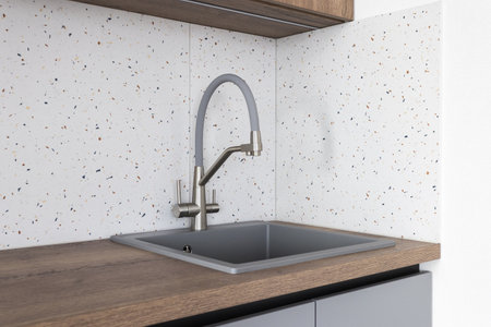 kitchen faucet on a stylish metal sinkの写真素材