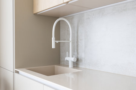 kitchen faucet on a stylish metal sinkの写真素材