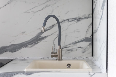 kitchen faucet on a stylish metal sinkの写真素材