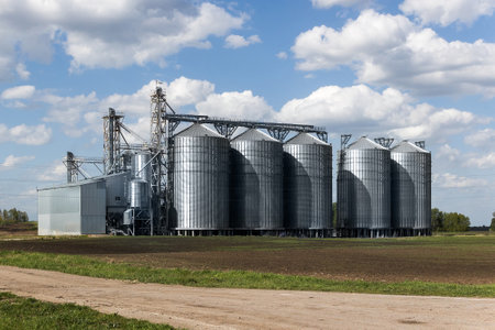 Grain silos on a farm in the countryside of Poland.の写真素材