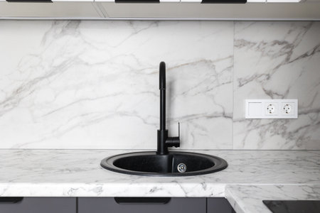 kitchen faucet on a stylish metal sink