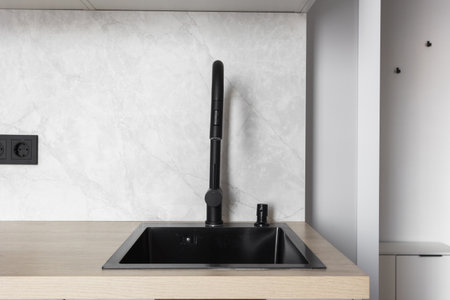 kitchen faucet on a stylish metal sink