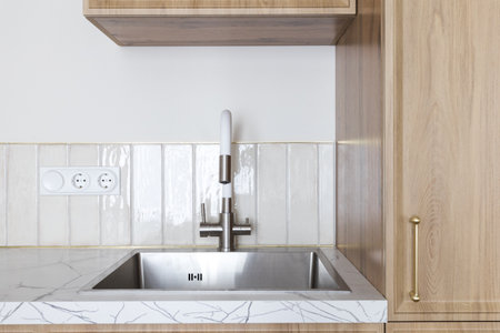 kitchen faucet on a stylish metal sink