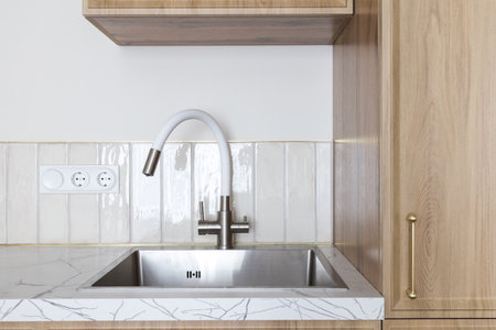 kitchen faucet on a stylish metal sink