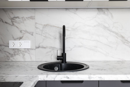 kitchen faucet on a stylish metal sink