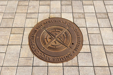 manhole cover on the tiled pavementの写真素材