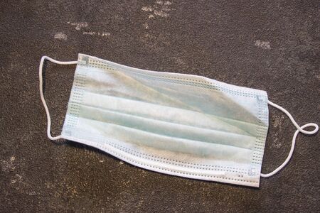 Coronavirus and Flu Control. Medical mask on a black background.の写真素材