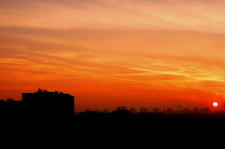 red sunset in the city with the accurate line of buildings