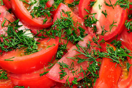 sliced fresh tomato with dill. closeupの写真素材