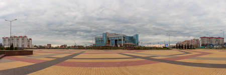 ZHODINO, BELARUS - APR. 08, 2017: Panoramic view of the main square of the city. Modern Palace of Culture of Metallurgists. Cloudy spring weatherのeditorial素材