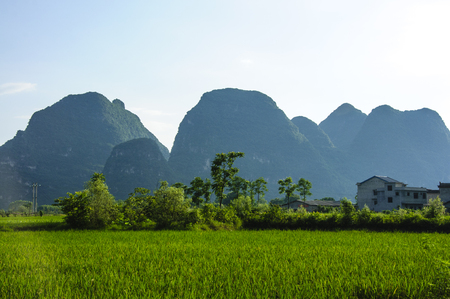 Karst mountains and rural scenery in summerの写真素材