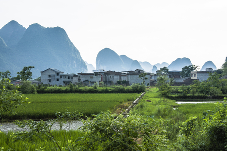 Karst mountains and rural scenery in summerの写真素材
