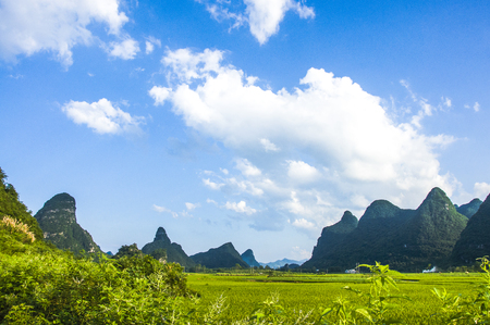 Karst mountains and rural scenery in summerの写真素材