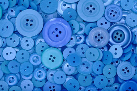 A large pile of blue buttons.の写真素材