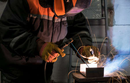 Welders working at the plant produce metal structures.