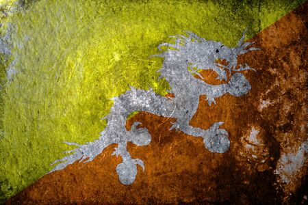 A dirty, grunge design of the flag of Bhutanの写真素材
