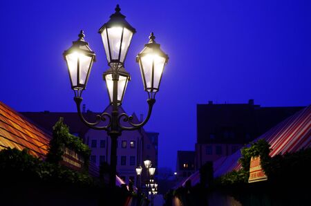 Street lamps in the early morning of a German Christmas marketの写真素材