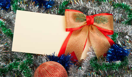 Christmas card with empty copy space and golden bowの写真素材