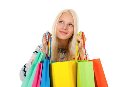 winter shopping woman happy smiling holding colorful bagsの写真素材