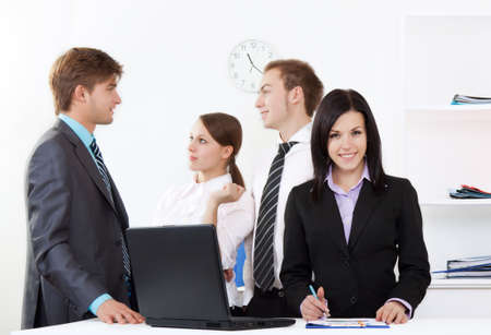 young business people in office at the deskの写真素材