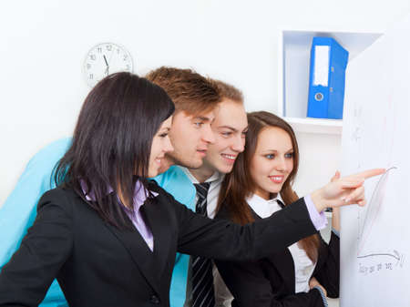 young business people in office at the deskの写真素材