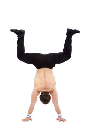 caucasian man acrobatics gymnastic doing a exercise athletic sportsman
