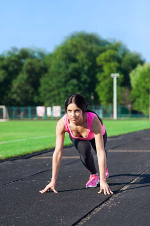 Woman start position on stadium
