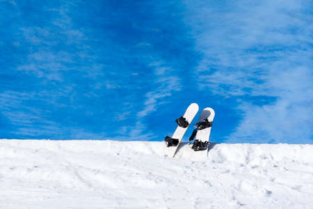 two snowboard in snow mountain slopeの写真素材