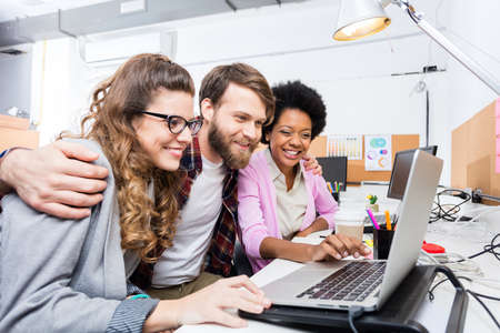 People office diverse mix race group looking laptop screen computer businesspeople