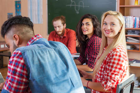Mixed Race Students Group With Professor Sit Desk University Classroom, Two Beautiful Young Girls...