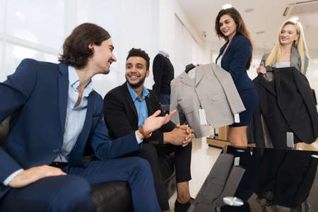 Handsome Business Man And Woman Fashion Shop, Customers Choosing Clothes In Retail Store Young...