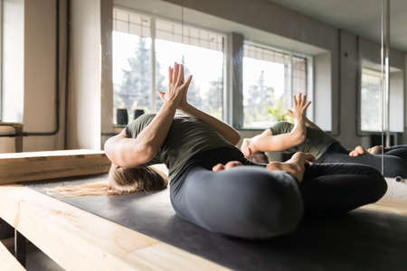 Woman Doing Yoga Exercises In Gym, Sport Fitness Girl Training Stretching Studio