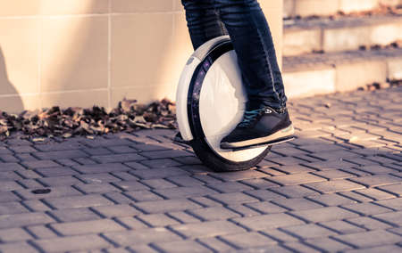 Man legs mono wheel personal electrical transport street outdoor