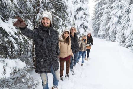 Man Lead Friends Group Snow Forest Young People Walking Outdoor Winter Pine Woods
