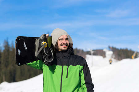 Man Tourist Snowboard Ski Resort Snow Winter Mountain Happy Smiling Guy On Holiday Extreme Sport Vacationの写真素材
