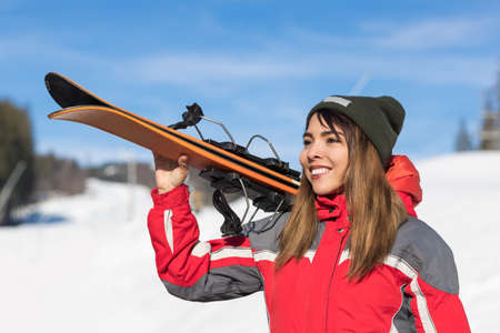Asian Girl Tourist Snowboard Ski Resort Snow Winter Mountain Happy Smiling Woman On Holiday Extreme Sport Vacationの写真素材