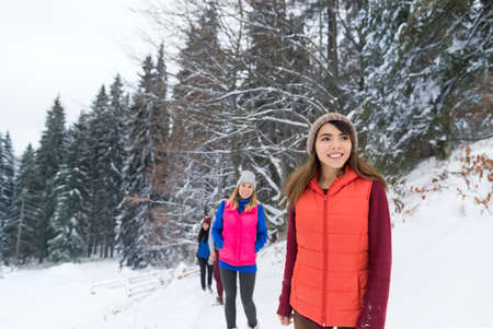 Friends Group Snow Forest Happy Smiling Young People Outdoor Winter Pine Mountain Woodsの写真素材