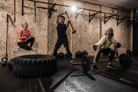 Sport Fitness People Group Crossfit Training Equipment, Serious Young Healthy Man And Woman Gym...