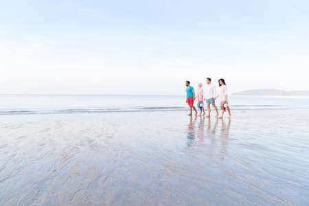 Young People Group On Beach Summer Vacation, Happy Smiling Friends Walking Seaside Sea Ocean Holiday Travelの写真素材