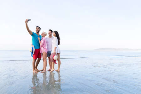 Young People Group On Beach Taking Selfie Photo On Cell Smart Phone Summer Vacation, Happy Smiling...