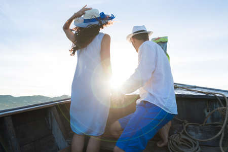 Young Couple Tourist Sail Long Tail Thailand Boat Ocean Sea Vacation Travel Trip Tropical Holidayの写真素材