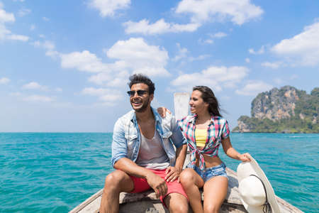 Young Couple Tourist Sail Long Tail Thailand Boat Ocean Sea Vacation Travel Trip Tropical Holidayの写真素材
