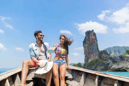 Young Couple Tourist Sail Long Tail Thailand Boat Ocean Sea Vacation Travel Trip Tropical Holidayの写真素材
